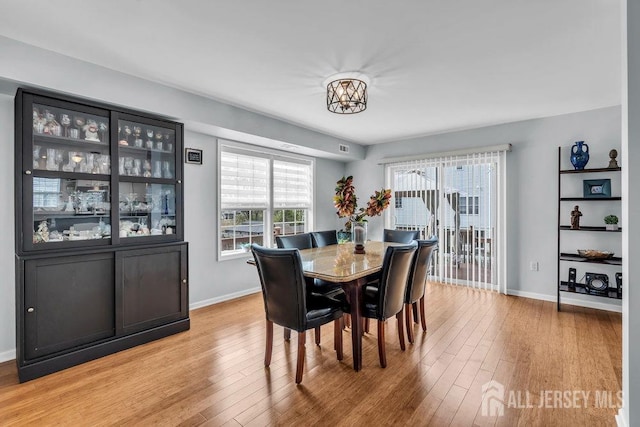904 4th St, Union Beach, NJ 07735 - dining room with light wood-style floors and baseboards