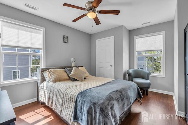 904 4th St, Union Beach, NJ 07735 - bedroom featuring baseboards, visible vents, and wood finished floors