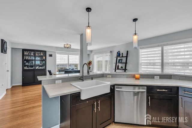 904 4th St, Union Beach, NJ 07735 - kitchen with dishwasher, light countertops, pendant lighting, and a sink