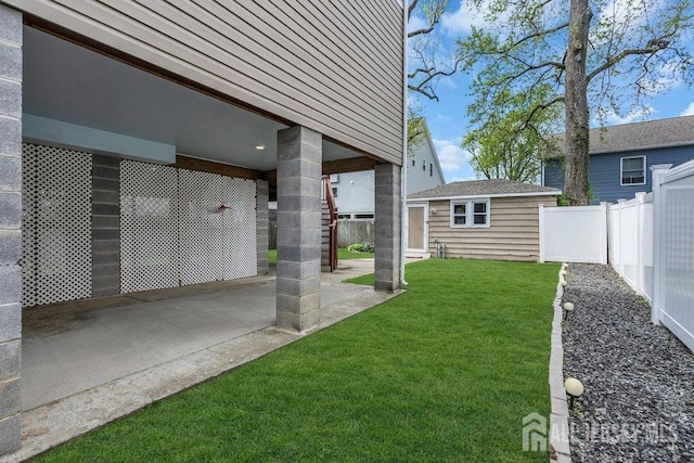 904 4th St, Union Beach, NJ 07735 - view of yard with a fenced backyard, a patio area, and an outbuilding