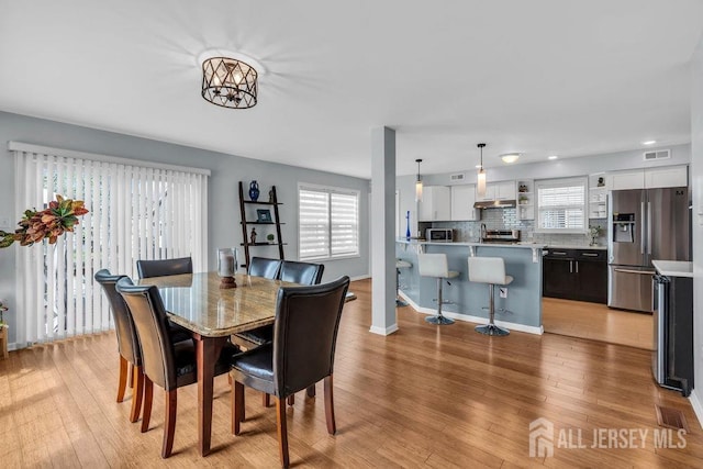 904 4th St, Union Beach, NJ 07735 - dining space featuring a wealth of natural light, light wood-style floors, and visible vents