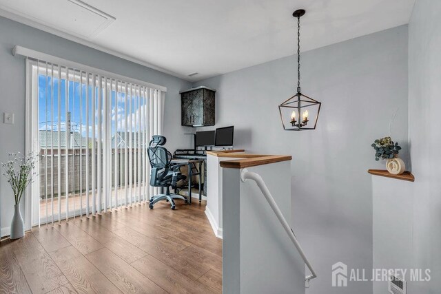 904 4th St, Union Beach, NJ 07735 - office space featuring baseboards, a notable chandelier, visible vents, and wood finished floors