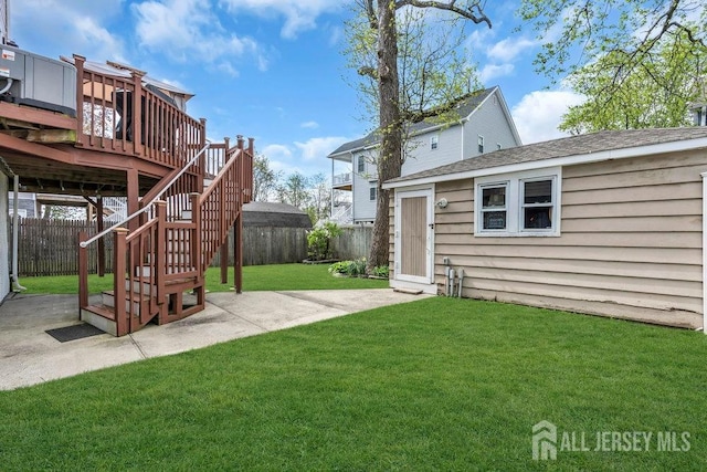 904 4th St, Union Beach, NJ 07735 - view of yard with a patio area, a deck, an outbuilding, and a fenced backyard