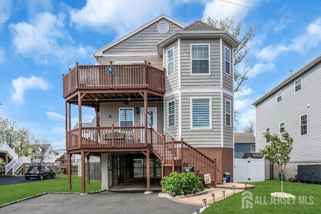 904 4th St, Union Beach, NJ 07735 - view of front of home featuring a gate, aphalt driveway, a carport, and a front lawn