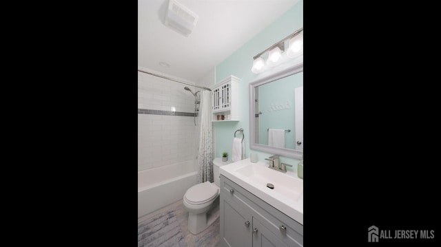 full bathroom with vanity, toilet, hardwood / wood-style floors, and shower / bath combo with shower curtain