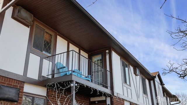 view of side of home featuring a balcony