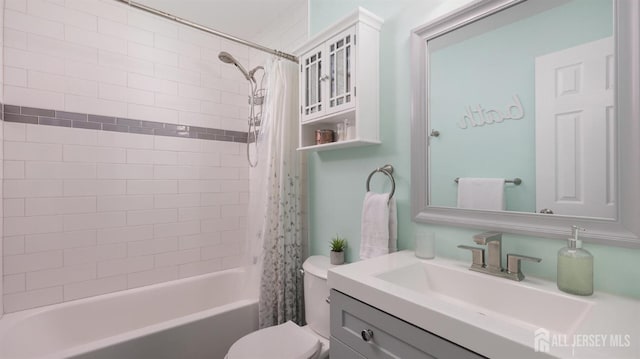 bathroom featuring toilet, shower / bathtub combination with curtain, and vanity