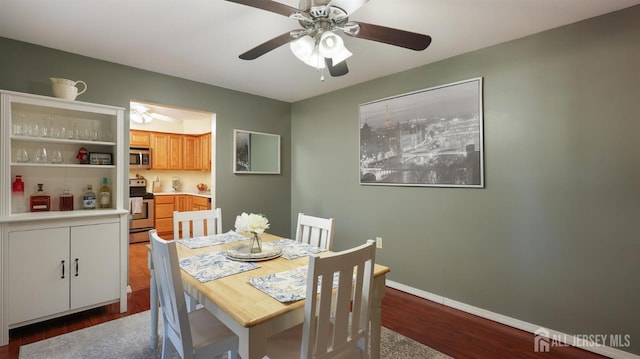 dining space featuring hardwood / wood-style flooring and ceiling fan