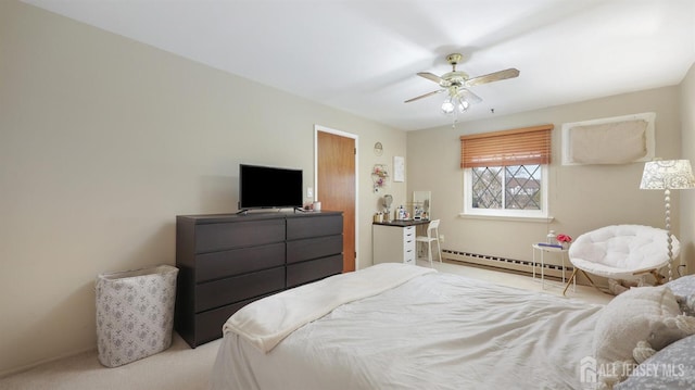 carpeted bedroom with a baseboard radiator and ceiling fan