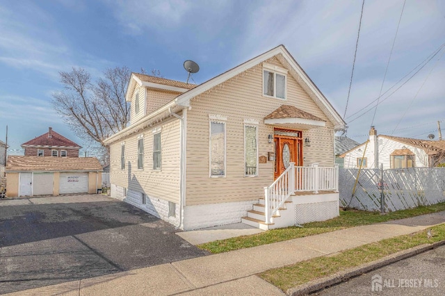 118 Holly St, Port Reading, NJ 07064 - view of front of house with a detached garage and an outdoor structure