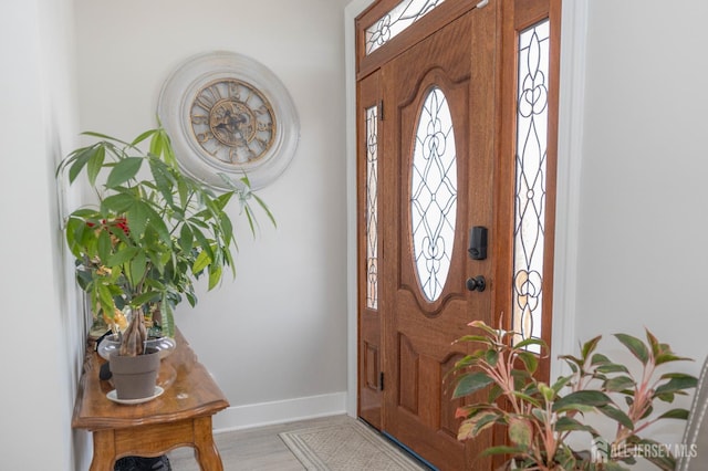 118 Holly St, Port Reading, NJ 07064 - foyer featuring baseboards and light wood-type flooring