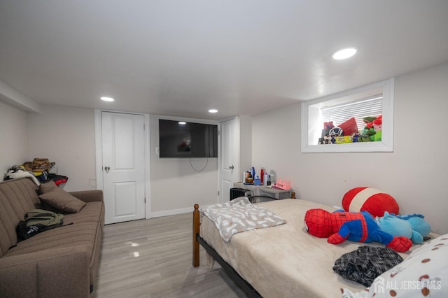 118 Holly St, Port Reading, NJ 07064 - bedroom with light wood finished floors, recessed lighting, and baseboards