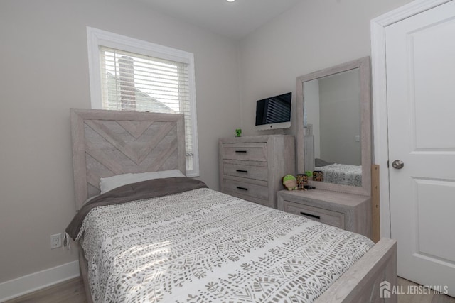 118 Holly St, Port Reading, NJ 07064 - bedroom with baseboards and wood finished floors