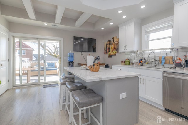 118 Holly St, Port Reading, NJ 07064 - kitchen featuring stainless steel dishwasher, recessed lighting, light wood finished floors, a center island, and tasteful backsplash