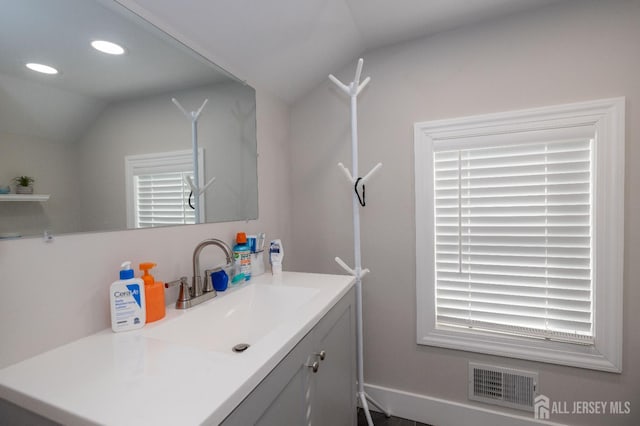 118 Holly St, Port Reading, NJ 07064 - bathroom with lofted ceiling, recessed lighting, and vanity