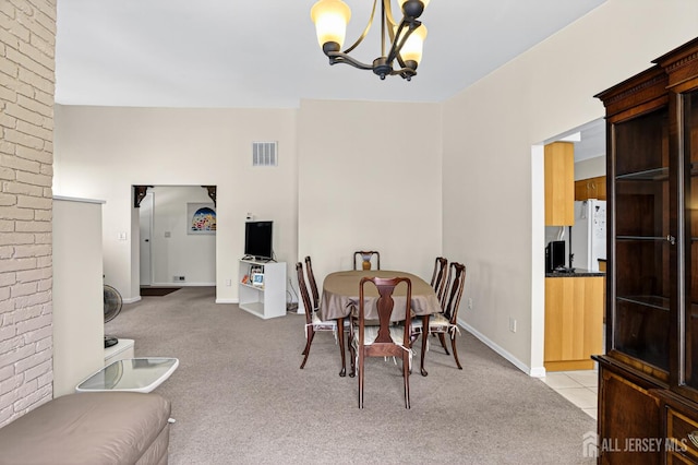 29 Whittney Ct, East Brunswick, NJ 08816 - dining space featuring light colored carpet and a chandelier