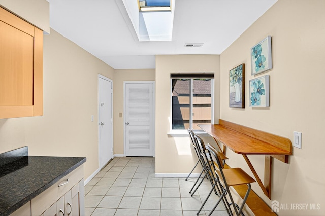 29 Whittney Ct, East Brunswick, NJ 08816 - dining area featuring a skylight and light tile patterned flooring