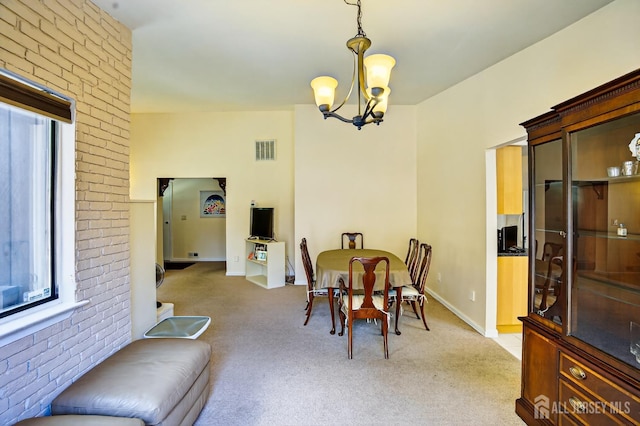 29 Whittney Ct, East Brunswick, NJ 08816 - dining area featuring a chandelier, light colored carpet, and brick wall