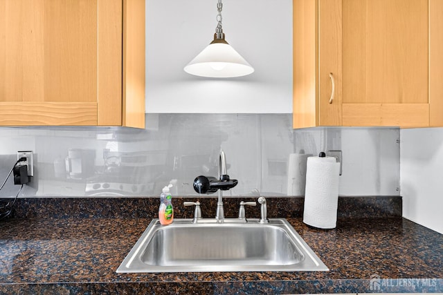 29 Whittney Ct, East Brunswick, NJ 08816 - kitchen view of dark countertops, tasteful backsplash, and hanging light fixtures