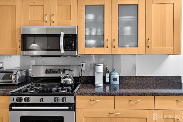29 Whittney Ct, East Brunswick, NJ 08816 - kitchen with appliances with stainless steel finishes, tasteful backsplash, glass insert cabinets, and light brown cabinetry
