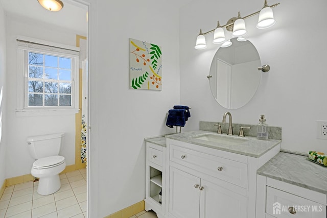 full bath featuring toilet, tile patterned flooring, baseboards, and vanity