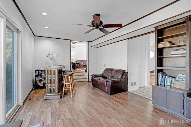 office featuring crown molding, recessed lighting, visible vents, ceiling fan, and wood finished floors