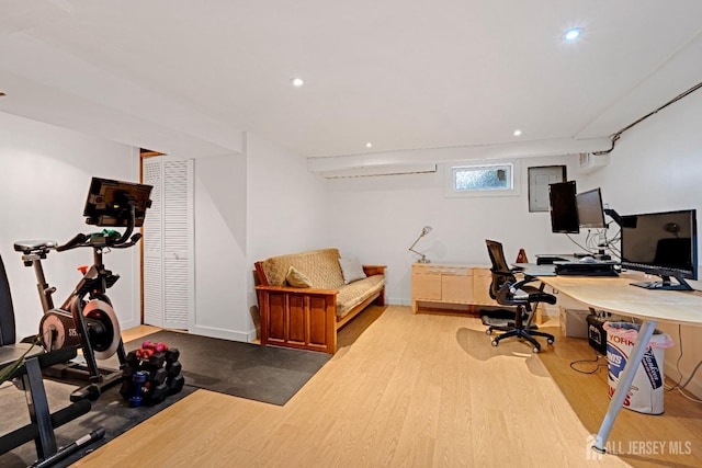 office featuring recessed lighting, baseboards, and wood finished floors