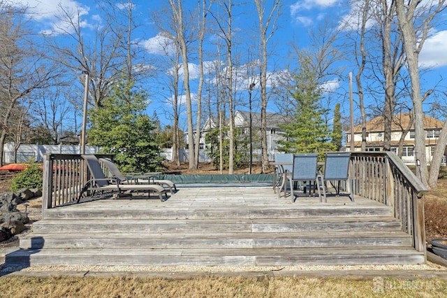 wooden deck featuring outdoor dining area