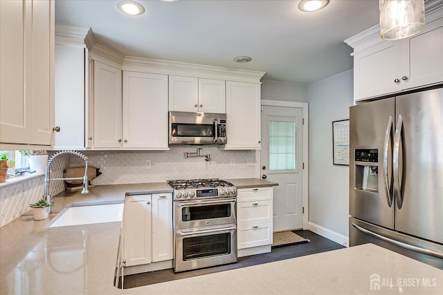 24 Turner Ct, Metuchen, NJ 08840 - kitchen with appliances with stainless steel finishes, white cabinetry, decorative backsplash, and recessed lighting