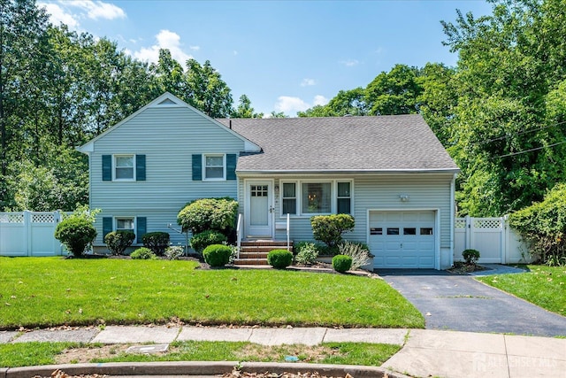 24 Turner Ct, Metuchen, NJ 08840 - split level home with an attached garage, driveway, and a shingled roof