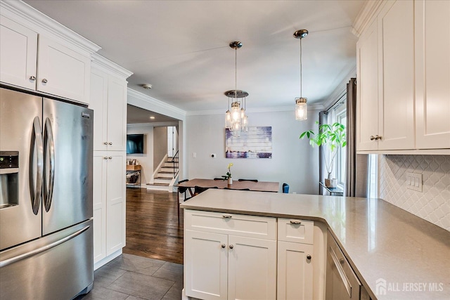 24 Turner Ct, Metuchen, NJ 08840 - kitchen featuring stainless steel refrigerator with ice dispenser, a peninsula, backsplash, white cabinetry, and light countertops