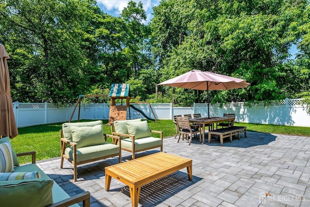 24 Turner Ct, Metuchen, NJ 08840 - fenced backyard with outdoor lounge area, a patio area, a playground, outdoor dining area, and view of scattered trees