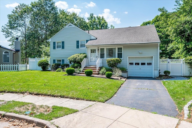 24 Turner Ct, Metuchen, NJ 08840 - tri-level home featuring a garage, driveway, and a shingled roof