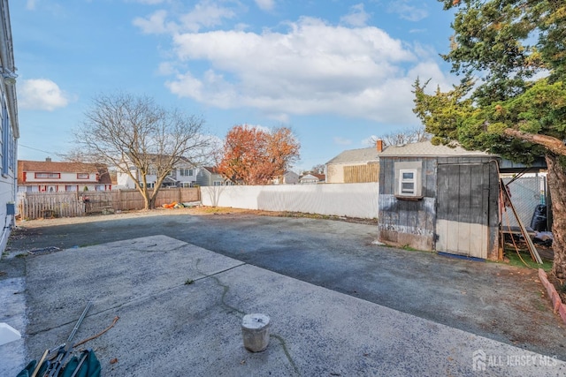 view of patio featuring a shed