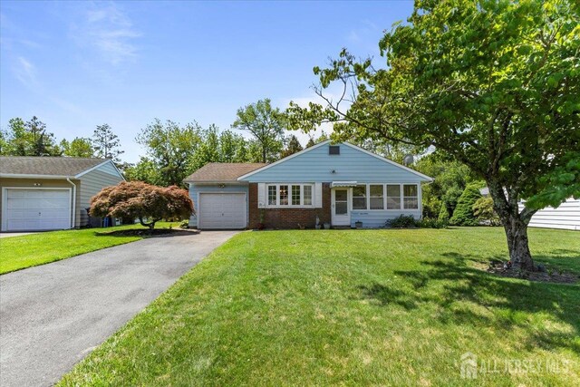 17 Columbine Cir, Toms River, NJ 08755 - ranch-style house featuring an attached garage, asphalt driveway, and a front yard