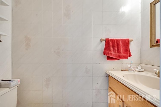 39 Gary Ct, South Brunswick, NJ 08810 - bathroom with vanity, toilet, and tile walls