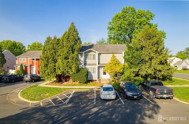 39 Gary Ct, South Brunswick, NJ 08810 - view of property hidden behind natural elements with uncovered parking and a residential view