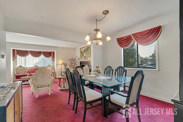 39 Gary Ct, South Brunswick, NJ 08810 - dining space featuring healthy amount of natural light, a chandelier, and carpet floors