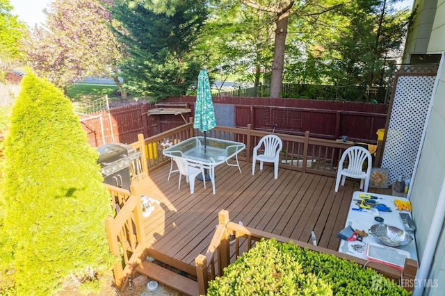 39 Gary Ct, South Brunswick, NJ 08810 - wooden deck featuring outdoor dining area and a fenced backyard