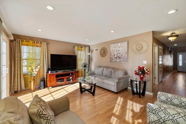 861 S Birch St S, Perth Amboy, NJ 08861 - living room featuring healthy amount of natural light, wood finished floors, recessed lighting, and baseboards
