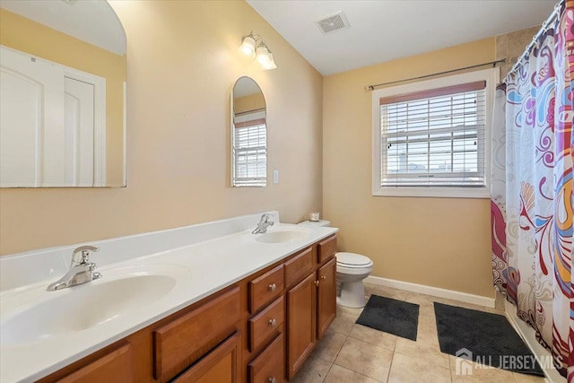 861 S Birch St S, Perth Amboy, NJ 08861 - full bathroom featuring plenty of natural light, tile patterned floors, toilet, and double vanity