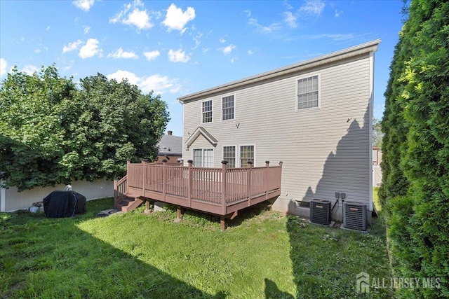 861 S Birch St S, Perth Amboy, NJ 08861 - rear view of house featuring a lawn, central AC unit, and a deck