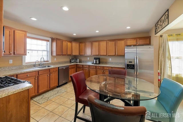 861 S Birch St S, Perth Amboy, NJ 08861 - kitchen featuring appliances with stainless steel finishes, a sink, light countertops, healthy amount of natural light, and recessed lighting
