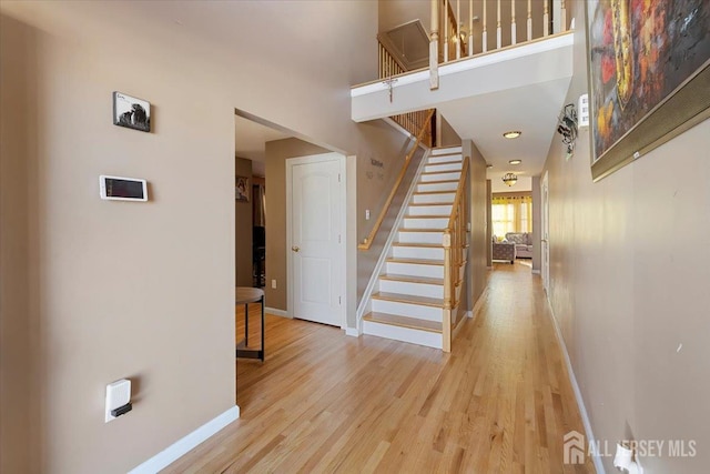 861 S Birch St S, Perth Amboy, NJ 08861 - staircase with baseboards, wood finished floors, and a towering ceiling