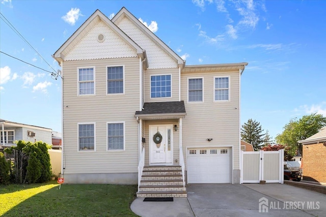 861 S Birch St S, Perth Amboy, NJ 08861 - view of front facade with an attached garage, driveway, and a gate