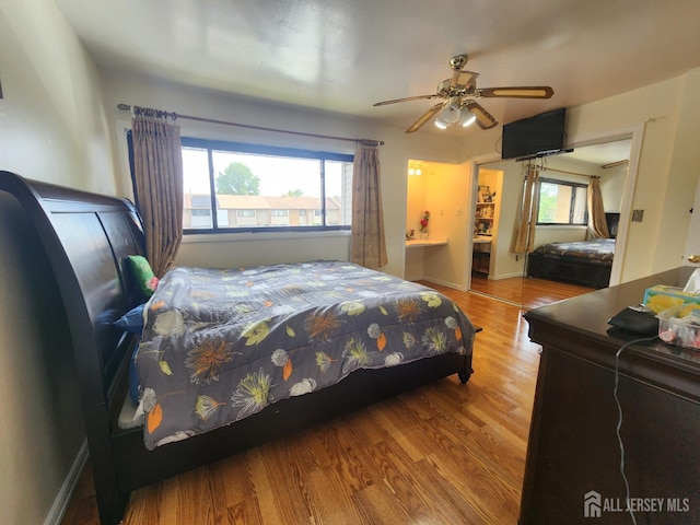 74 Probasco Rd, East Windsor, NJ 08520 - bedroom with multiple windows, wood finished floors, and ceiling fan