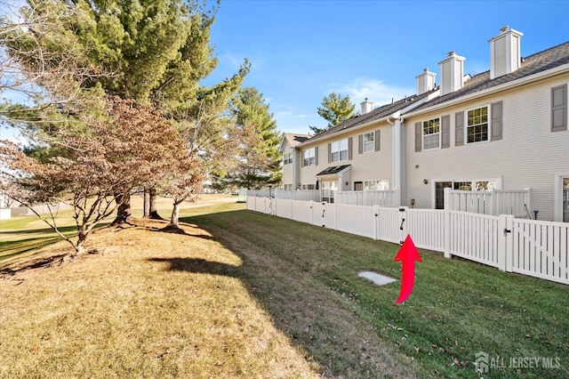 view of yard with a fenced backyard