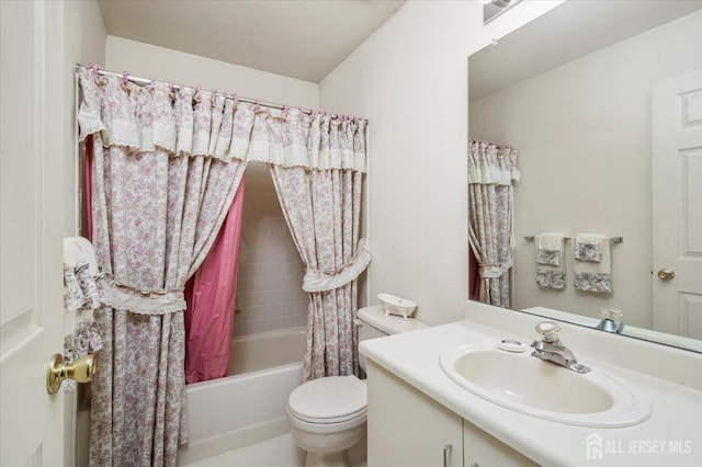 full bath featuring shower / bath combo, vanity, and toilet