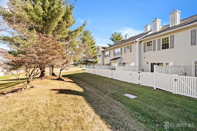 view of yard with a gate and fence