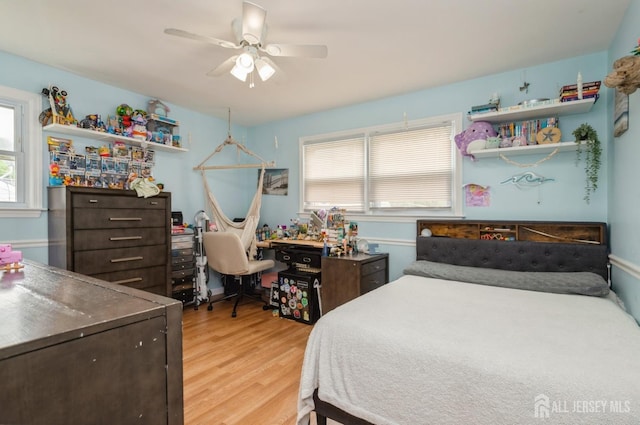 29 De Stefano Ave, Spotswood, NJ 08884 - bedroom with light wood-style flooring, multiple windows, and a ceiling fan